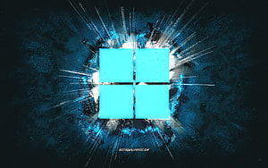 Windows 11 Grunge Logo with Cyan Light Burst on Dark Textured Background HD wallpaper