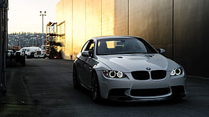 Silver BMW M3 E92 Coupe Parked in Industrial Setting at Golden Hour HD wallpaper