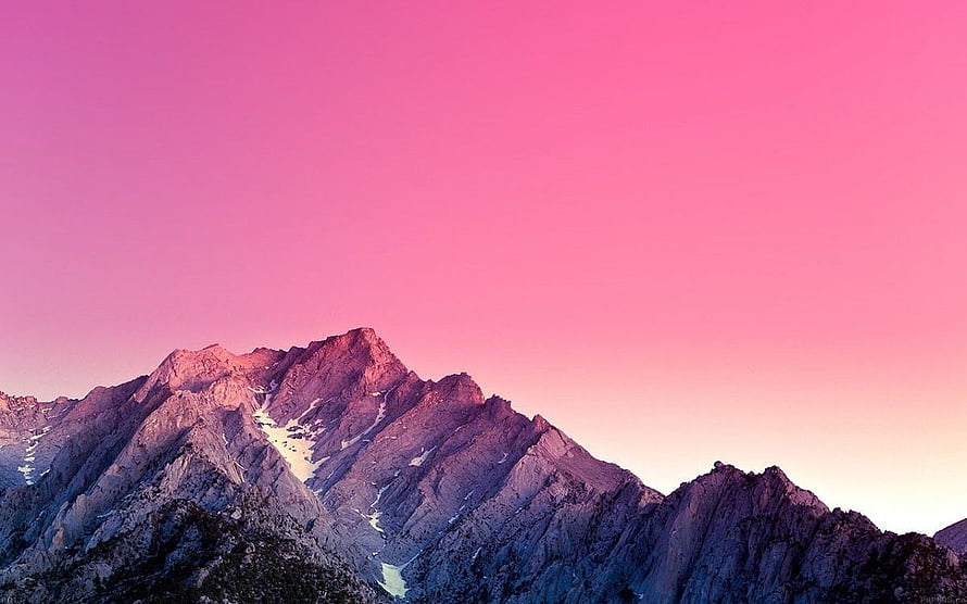 Pink Sky Over Snow-Capped Mountain Peaks at Sunset HD wallpaper