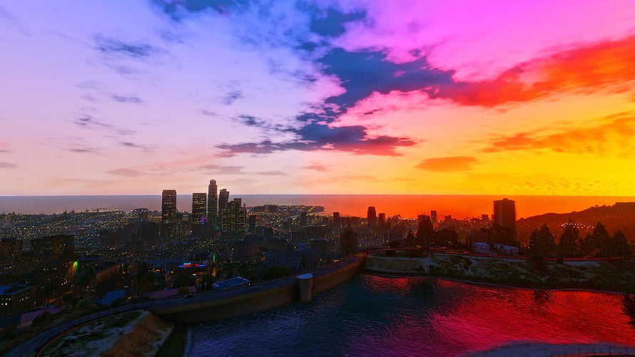 GTA V Los Santos Skyline at Sunset with Vibrant Pink and Orange Clouds HD wallpaper