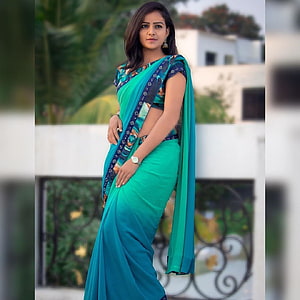 Vaishnavi Chaitanya in a Teal Saree with Patterned Border on a Balcony HD phone wallpaper