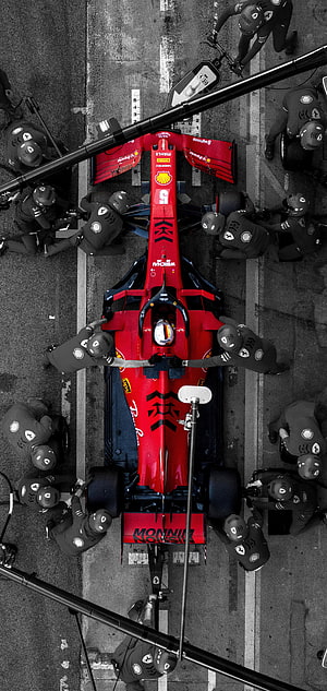 Aerial View of Ferrari Formula 1 Pit Stop Crew Working on Red Race Car HD phone wallpaper