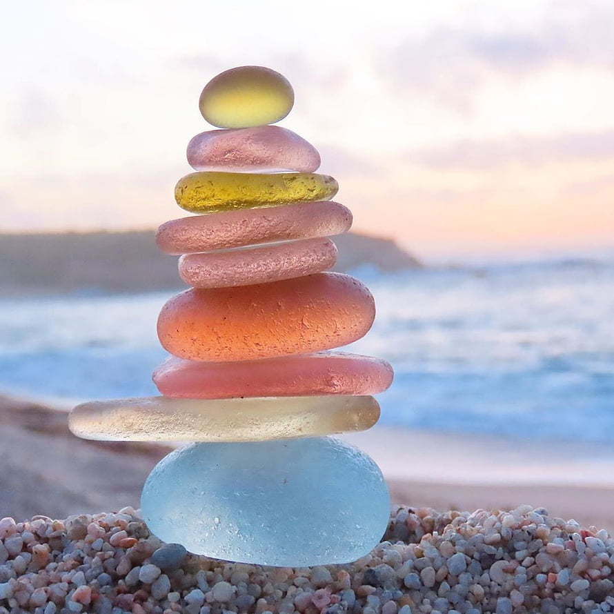 Colorful Sea Glass Zen Stack on a Beach at Sunset HD phone wallpaper