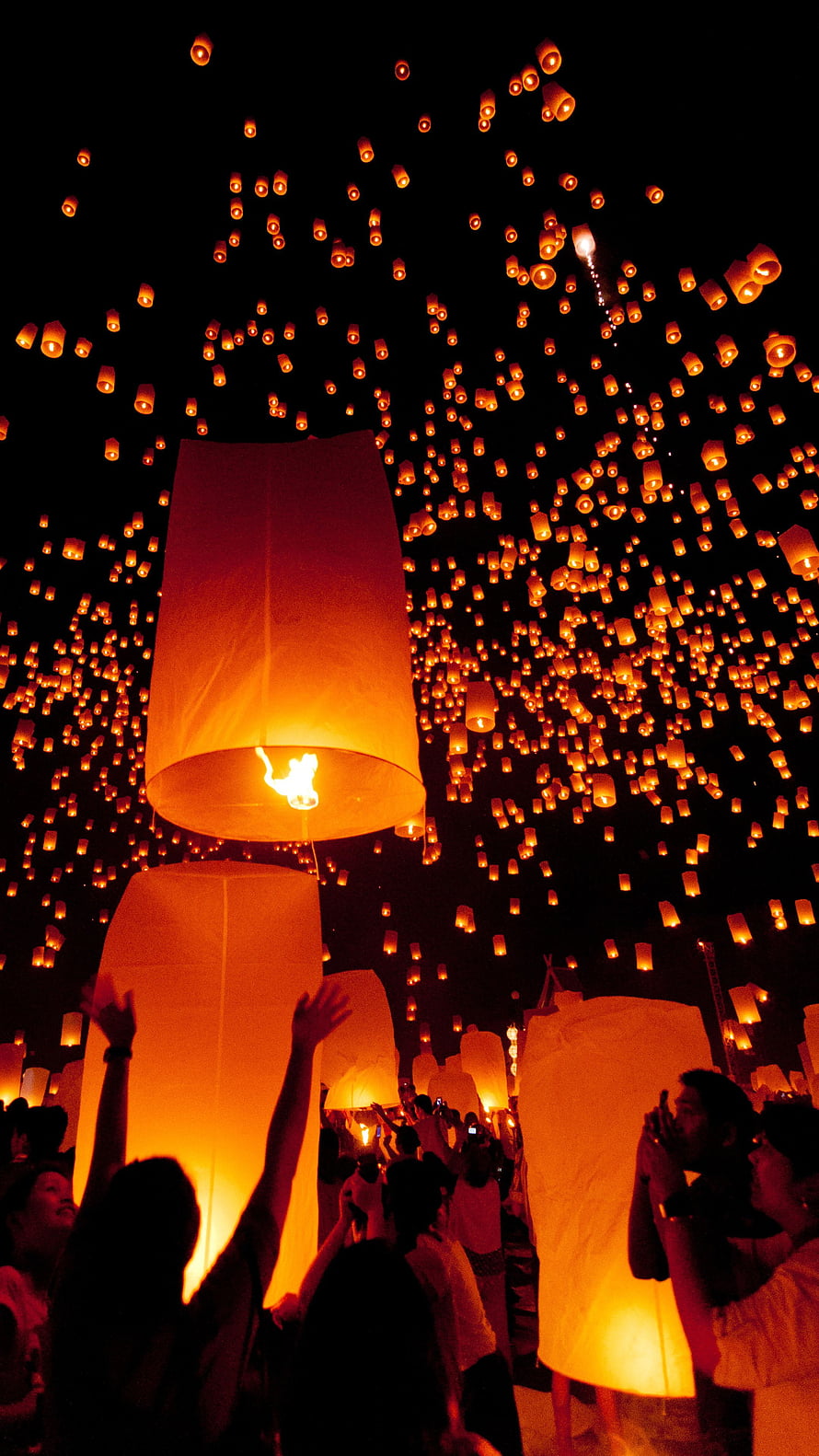 Sky Full of Glowing Sky Lanterns at a Nighttime Festival HD phone wallpaper