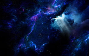 Vibrant Cosmic Nebula with Swirling Purple and Blue Gas Clouds in Deep Space HD wallpaper