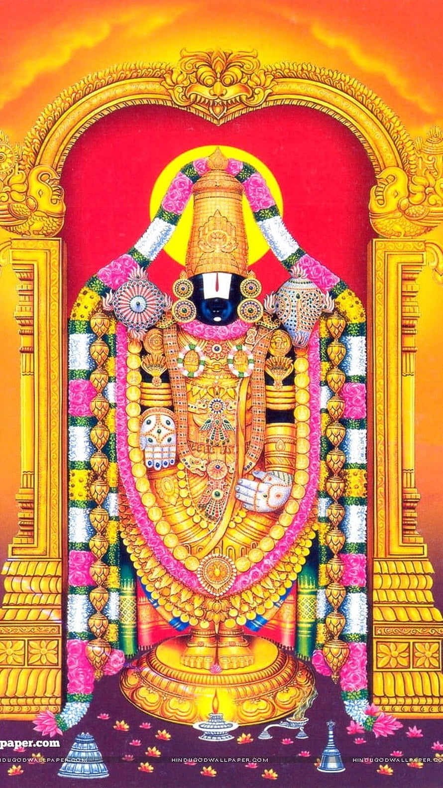 Lord Venkateswara Swamy adorned in gold ornaments and floral garlands within a temple arch HD phone wallpaper