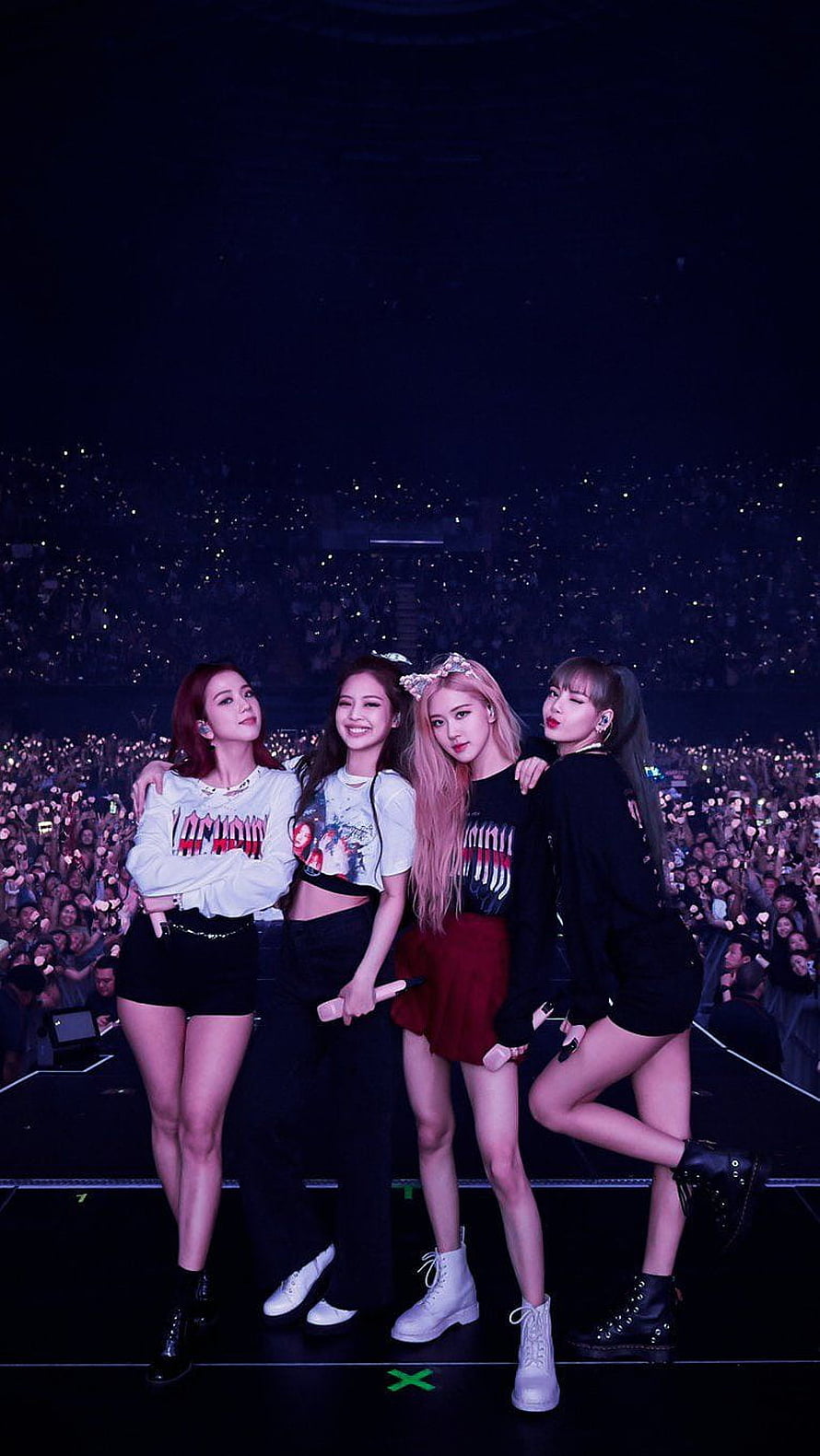 Blackpink K-pop Group Performing on Stage at a Large Concert with Glowing Audience HD phone wallpaper