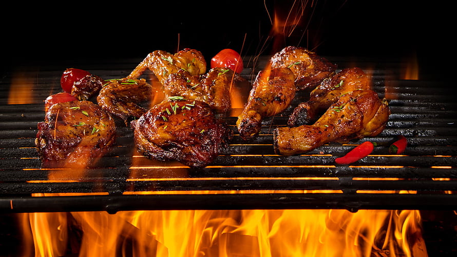 Juicy Grilled Chicken Pieces Sizzling Over Open Flames With Fresh Herbs And Red Peppers HD wallpaper