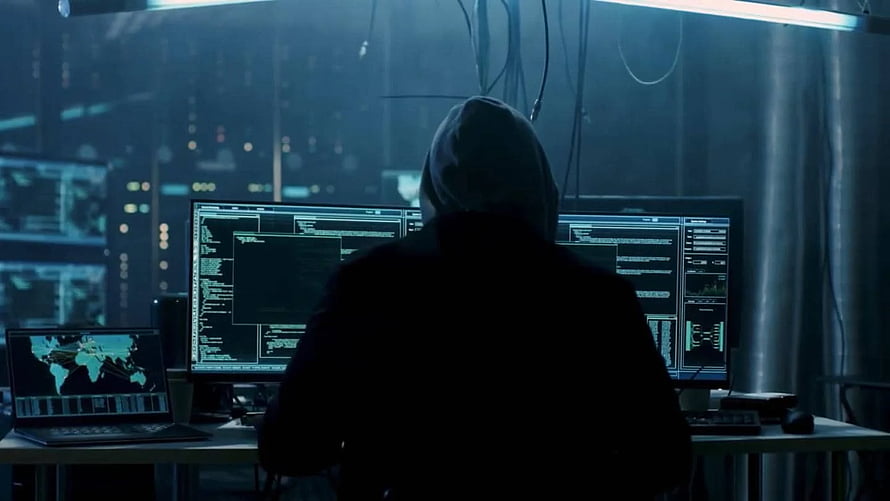 Hooded Hacker Silhouette at Multi-Monitor Cyber Defense Command Center HD wallpaper