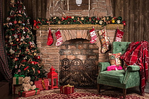 Cozy Rustic Christmas Living Room With Stone Fireplace, Stockings, And Decorated Tree HD wallpaper