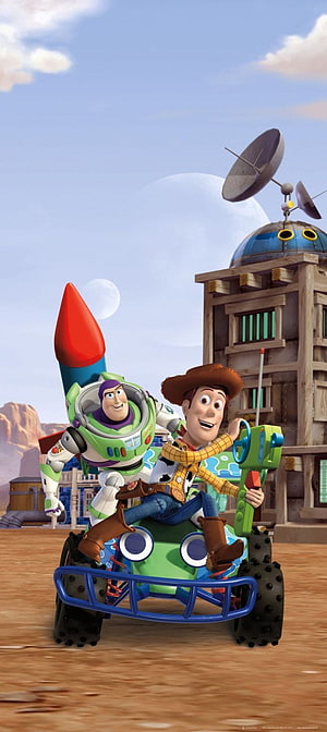Woody and Buzz Lightyear riding a toy rover in a desert landscape from Toy Story HD phone wallpaper