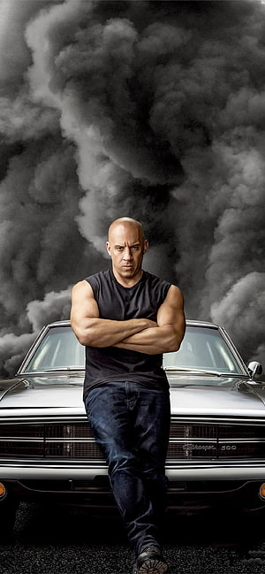 Vin Diesel as Dominic Toretto Leaning on a Dodge Charger in Fast and Furious HD phone wallpaper