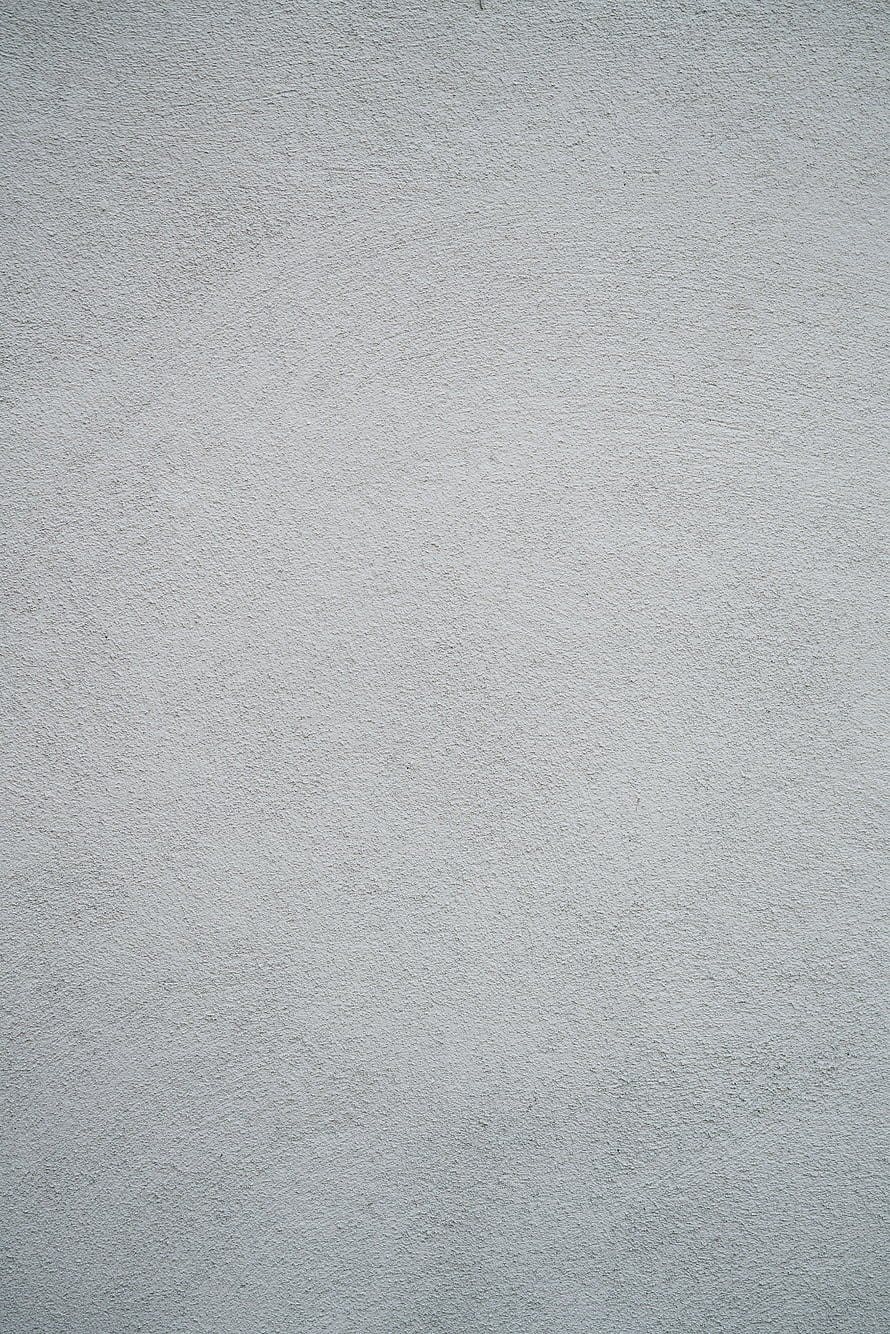 Minimalist Light Gray Plaster Wall Texture with Subtle Surface Grain and Matte Finish HD phone wallpaper