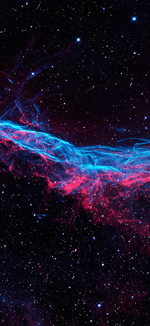 Vibrant Cosmic Nebula with Electric Blue and Crimson Gas Clouds Against a Starry Deep Space Background HD phone wallpaper
