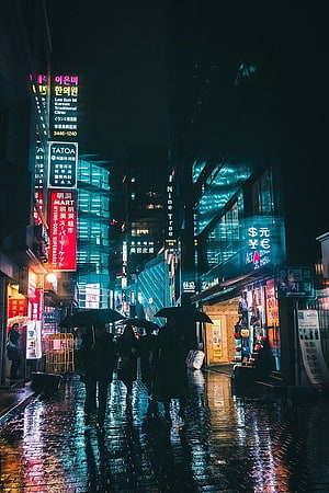 Rainy Night in Seoul: Neon-Lit Korean Street with Umbrellas and Reflections HD phone wallpaper