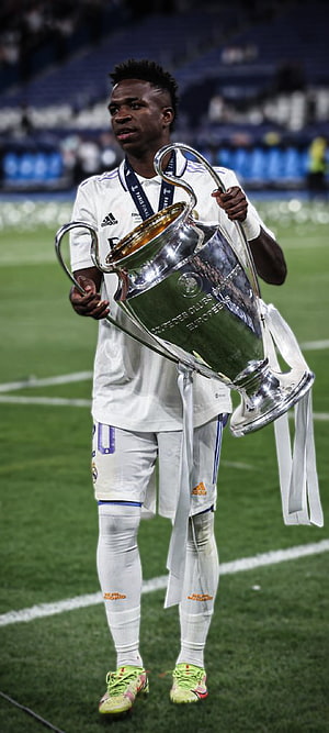 Vinicius Jr. Lifting The Champions League Trophy In Real Madrid Kit HD phone wallpaper