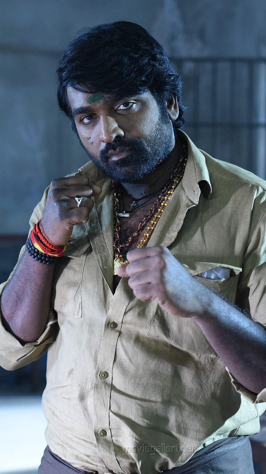 Vijay Sethupathi in a gritty action pose wearing a beige shirt and beaded necklaces HD phone wallpaper