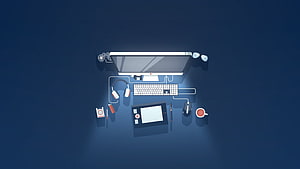 Top-Down Developer Workspace with Monitor, Keyboard, and Graphics Tablet on Dark Blue Desk HD wallpaper