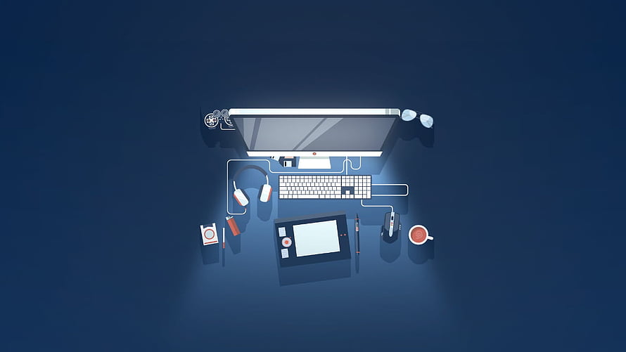 Top-Down Developer Workspace with Monitor, Keyboard, and Graphics Tablet on Dark Blue Desk HD wallpaper