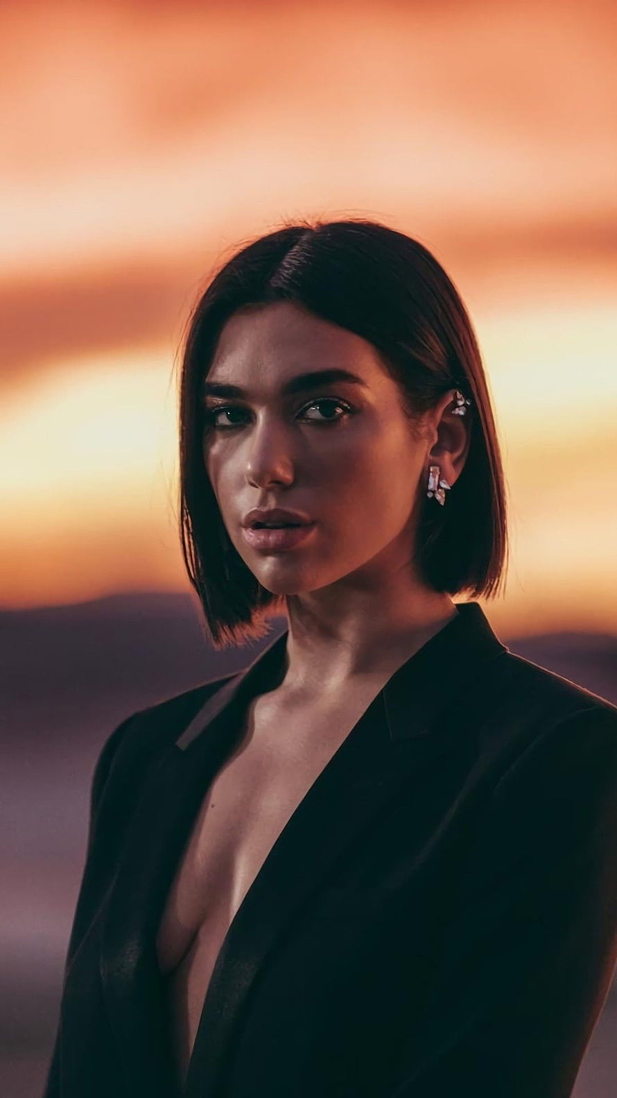 Dua Lipa Portrait in Black Blazer Against Warm Sunset Sky HD phone wallpaper