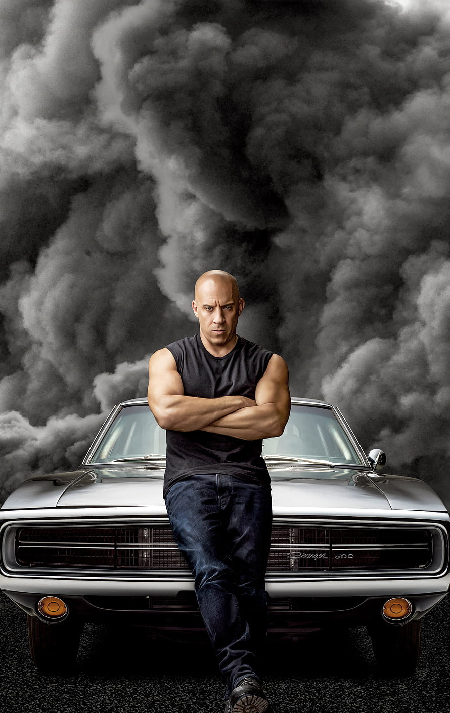 Vin Diesel Leaning on Classic Dodge Charger Against Dramatic Smoke Background HD phone wallpaper