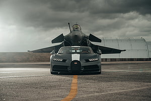 Bugatti Chiron Super Sport Parked Before a Dassault Rafale Fighter Jet on a Runway HD wallpaper