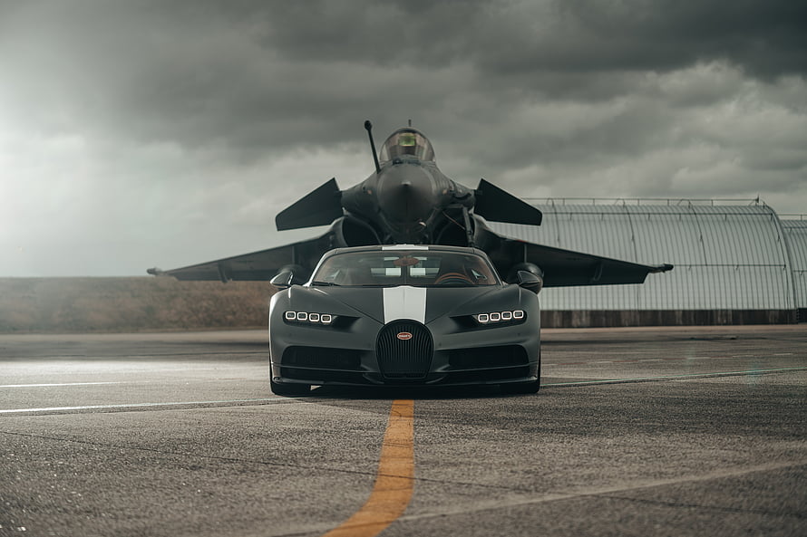 Bugatti Chiron Super Sport Parked Before a Dassault Rafale Fighter Jet on a Runway HD wallpaper