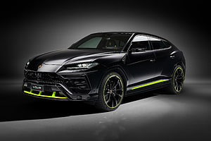 Lamborghini Urus SUV in Matte Black with Neon Green Accents on Dark Studio Background HD wallpaper