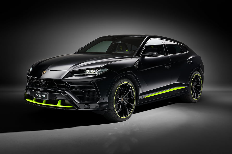 Lamborghini Urus SUV in Matte Black with Neon Green Accents on Dark Studio Background HD wallpaper