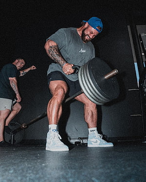 Cbum Performing Heavy Barbell Lift in Gym Training Session HD phone wallpaper