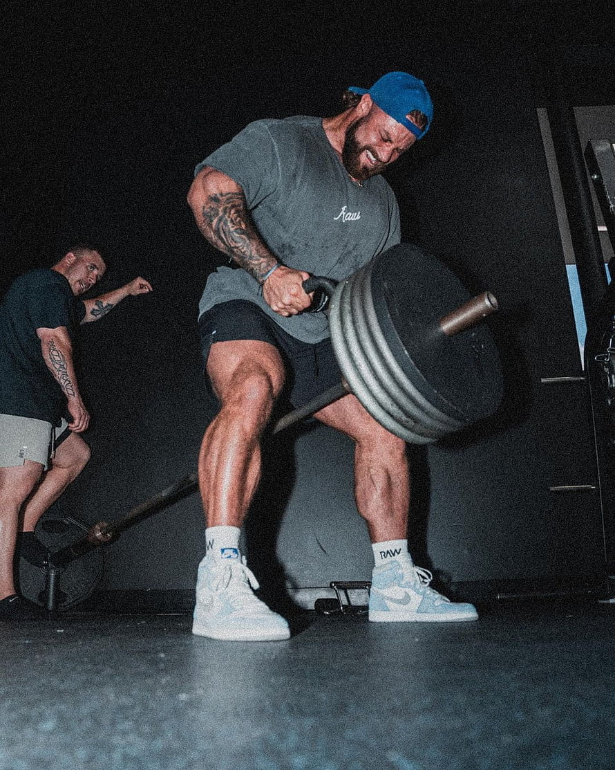 Cbum Performing Heavy Barbell Lift in Gym Training Session HD phone wallpaper
