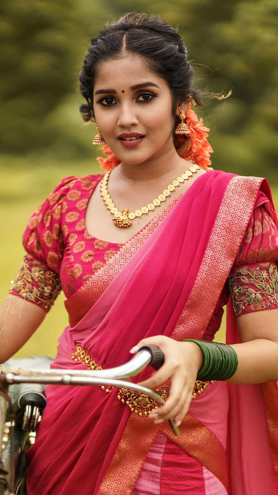 Anikha Surendran in Traditional Pink Saree with Gold Jewelry and Floral Hairpiece HD phone wallpaper
