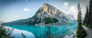 Turquoise Mountain Lake Scenic Landscape with Pine Forest and Rocky Peaks HD wallpaper