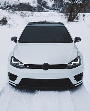 White Volkswagen Golf R Mk7 Front View in Snowy Winter Landscape HD phone wallpaper