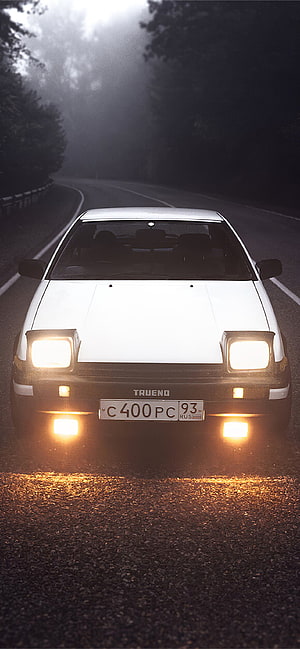 White Toyota AE86 Trueno Front View on a Misty Forest Road at Night HD phone wallpaper
