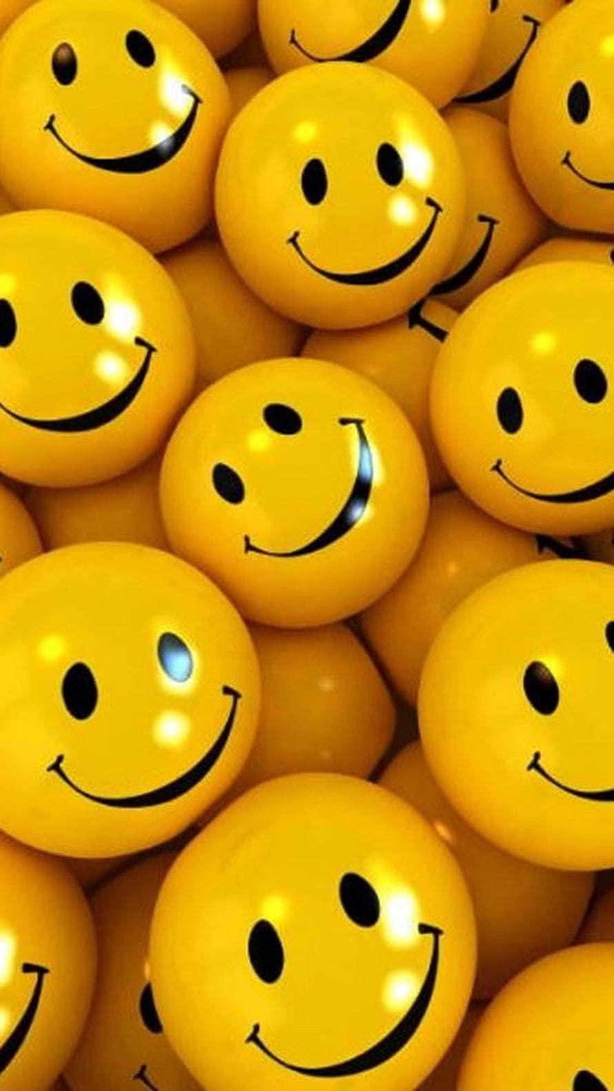 Glossy Yellow Smiley Face Balls Pile Up in a Bright and Cheerful Pattern HD phone wallpaper