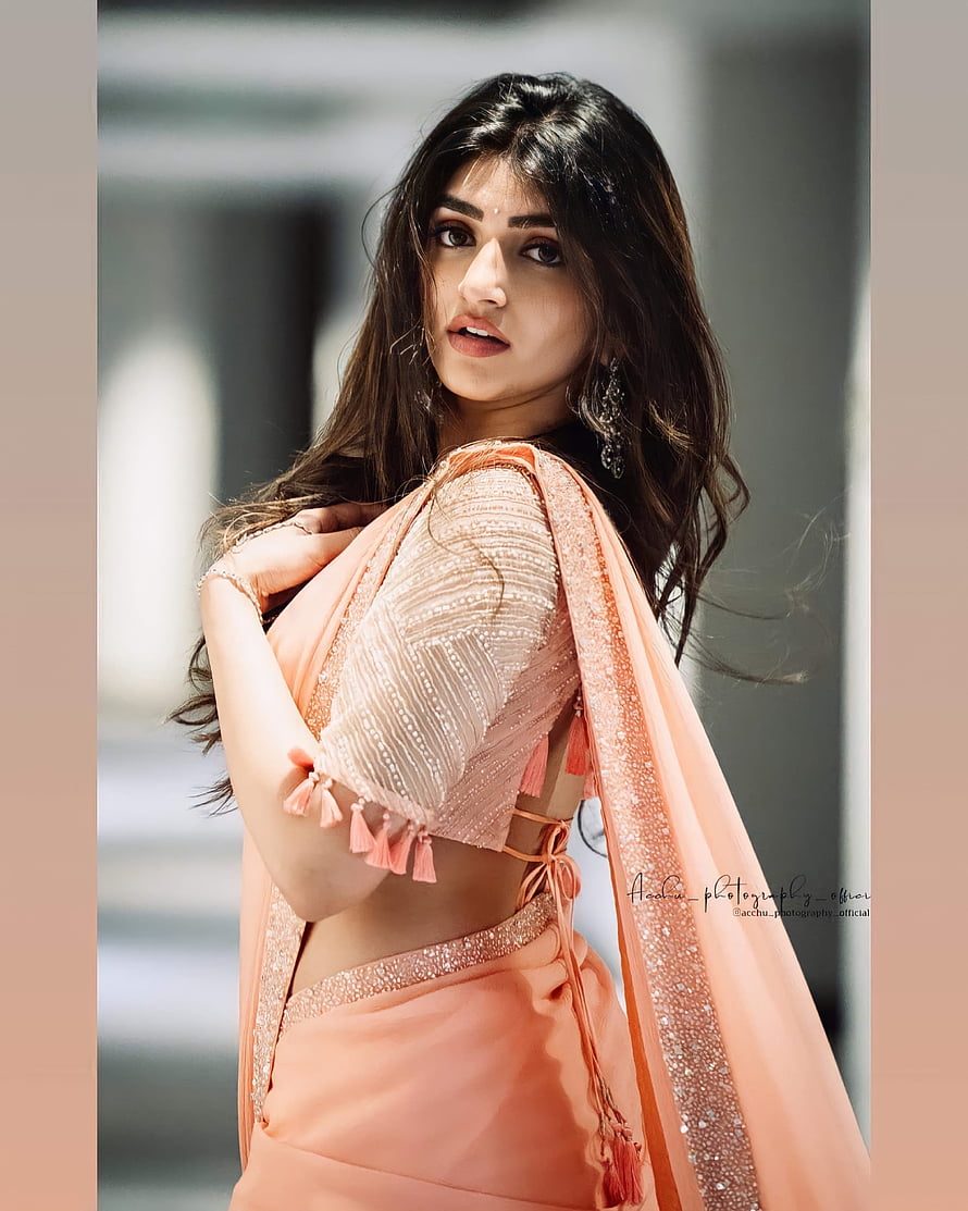 Sreeleela in a peach embroidered lehenga with sequined dupatta and tassel details HD phone wallpaper