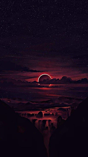 Crimson Eclipse Over Dark Canyon Landscape with Starry Night Sky HD phone wallpaper