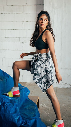 Malavika Mohanan in Black Sports Bra and Patterned Skirt with Colorful Sneakers HD phone wallpaper