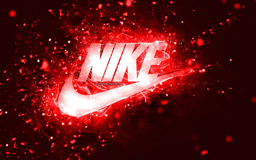 Nike Swoosh Logo Glowing in Red Particle Explosion on Dark Background HD wallpaper