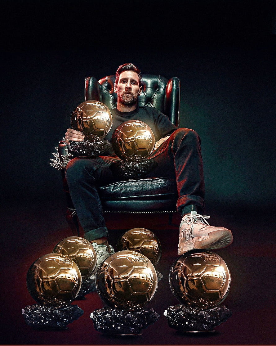 Lionel Messi Seated in Leather Chair Surrounded by Multiple Golden Ballon d'Or Trophies HD phone wallpaper