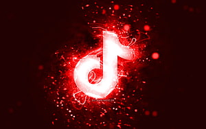 Glowing TikTok Logo With Red Neon Particles And Abstract Digital Energy Burst HD wallpaper