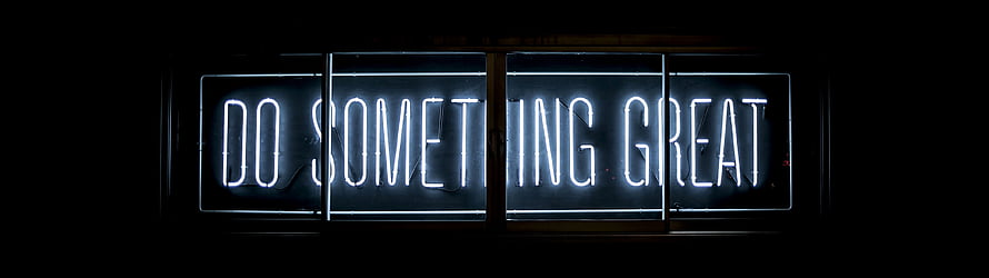Glowing Neon Sign Reading Do Something Great Against a Dark Background HD wallpaper
