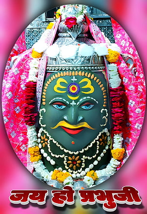 Mahakaleshwar deity adorned with vibrant floral garlands and traditional silver crown HD phone wallpaper