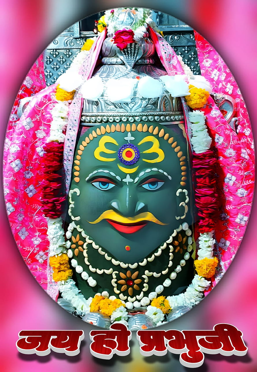 Mahakaleshwar deity adorned with vibrant floral garlands and traditional silver crown HD phone wallpaper