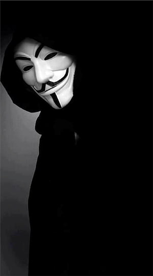 Anonymous Guy Fawkes Mask in Black Hoodie Against Dark Background HD phone wallpaper