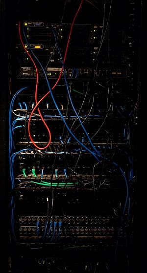 Dark Server Rack with Colorful Network Cables and Switches HD phone wallpaper