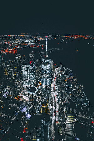 Aerial Night View of One World Trade Center and Lower Manhattan Skyline in New York City HD phone wallpaper
