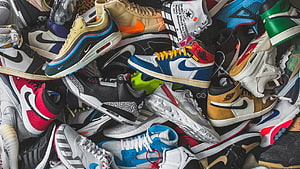 Colorful Collection of Nike and Adidas Sneakers Piled Together HD wallpaper