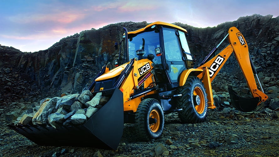 JCB 3DX Backhoe Loader Hauling Rocks in a Quarry at Sunset HD wallpaper